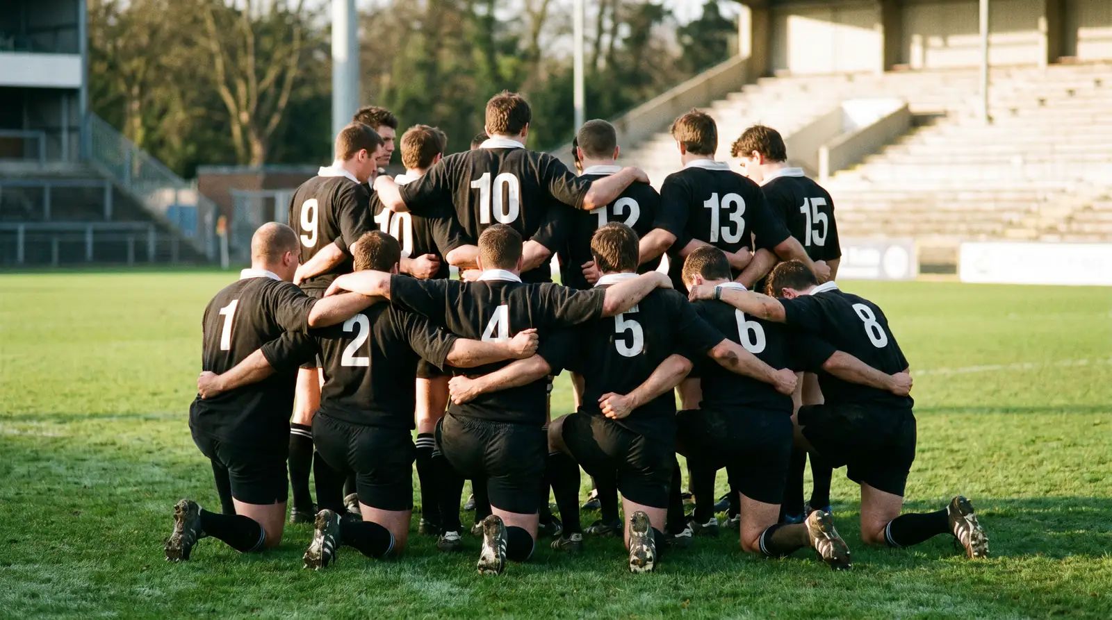 Forwards and backs in different shirt number bands lining up before kick-off