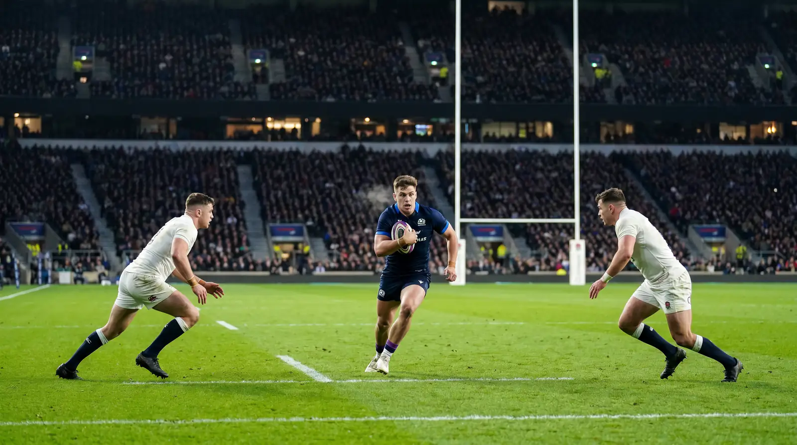 Six Nations rugby match in progress at a packed European stadium under floodlights.